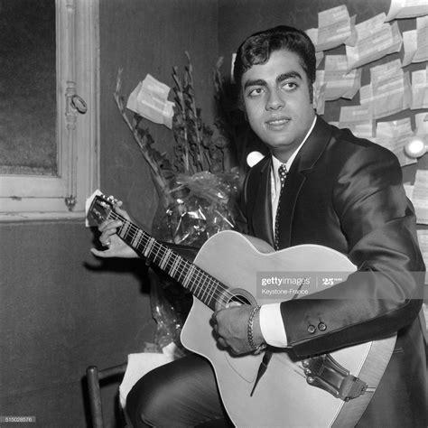 enrico macias   olympia  hall playing guitar backstage