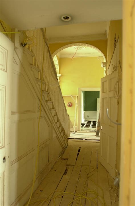 Arching windows, a grand entrance way and huge fireplaces; Photographs