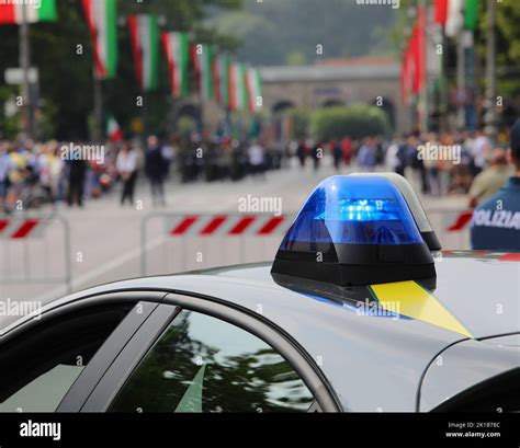 Police Car Siren During Outdoor Demonstration And Many Flags Stock