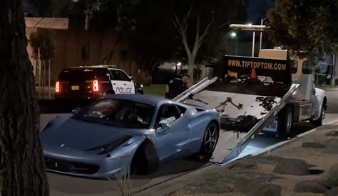 Getting A Crashed Ferrari Up On A Flatbed Truck Is An Owners Worst