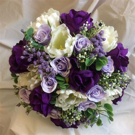 A Bridal Bouquet Of Purple Lilac And Ivory Silk Roses Tulips