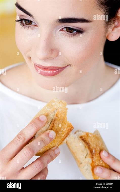 Woman Eating Bread Stock Photo Alamy