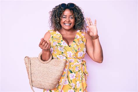 Young African American Plus Size Woman Wearing Casual Clothes Holding