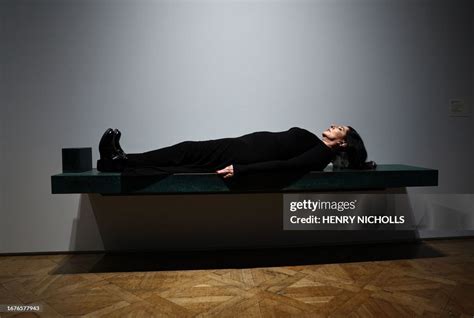 Serbian performance artist Marina Abramovic poses laying on one of ...