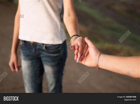 Girl And Guy Holding Hands