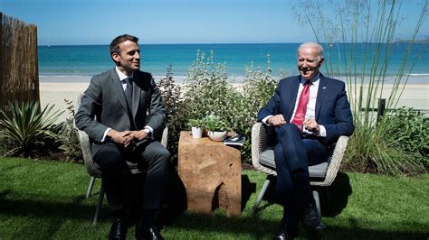 Biden "definitely" brings U.S. back into "club," Macron says at G7