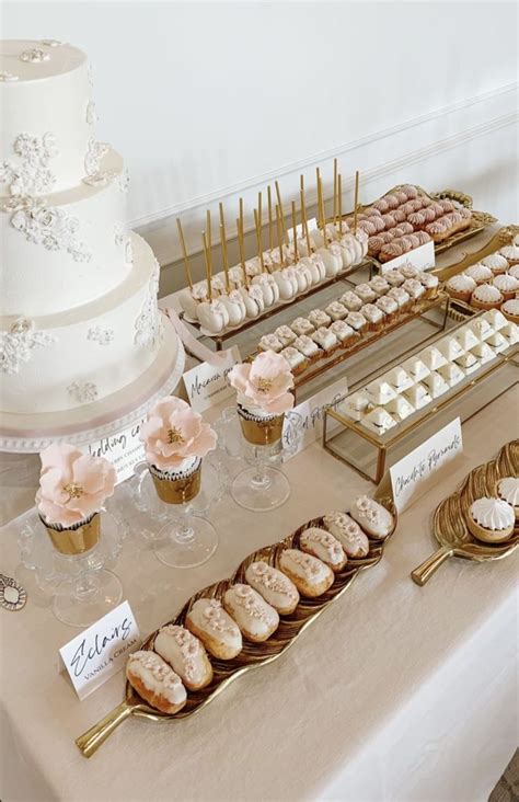 A Table Topped With Lots Of Desserts And Cupcakes