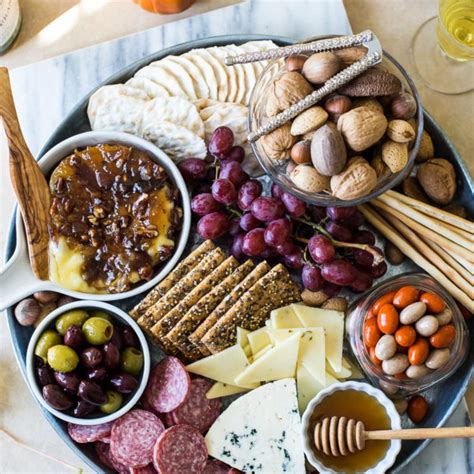 Holiday Cheese Board With Baked Brie With Bacon Onion Jam And Glazed