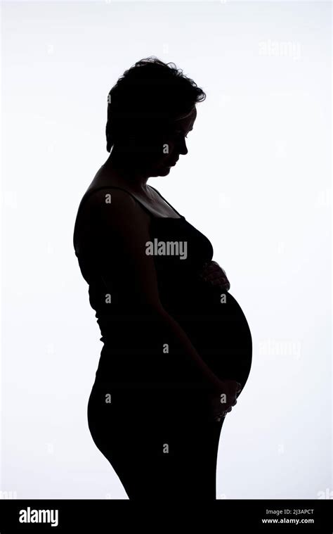 Portrait Of Pregnant Woman On Her Third Trimester Two Weeks Before Delivery Making Photo