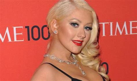 Christina Aguilera Flaunts Her Curvy Figure In A Low Cut Black Dress At