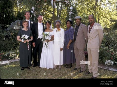 Austin Texas Usa Interracial Couple In Their Mid Twenties And Their Families Pose After Their