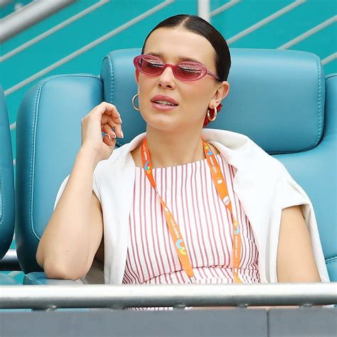 Millie Bobby Brown Is All Smiles In Red Bikini And Gold Hoop Earrings