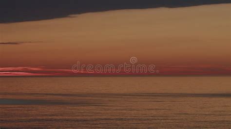 Water In Ocean With Sunset Reflected On Waves View Of Calm Waves