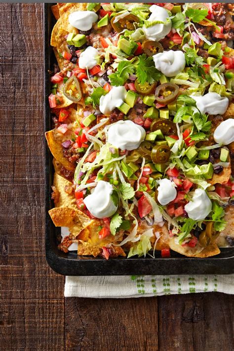 Best Loaded Nachos Recipe - How to Make Loaded Nachos - CountryLiving.com