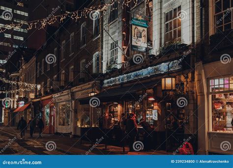 People Drinking Outside The Two Brewers Greene King Pub In Covent