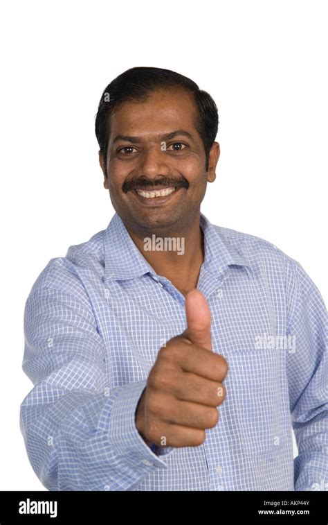 Mature Indian man thumbs up Stock Photo: 15047930 - Alamy