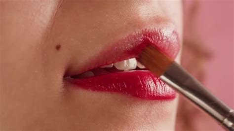 Young Woman Makeup With A Red Lipstick On Her Lips Closeup Shooting Of