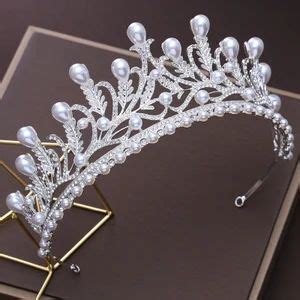 A Tiara With Pearls And Crystals On It