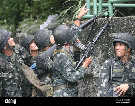 Philippine Marines Take Positions As Fellow Marines Unseen Storm The Peninsula Hotel At The