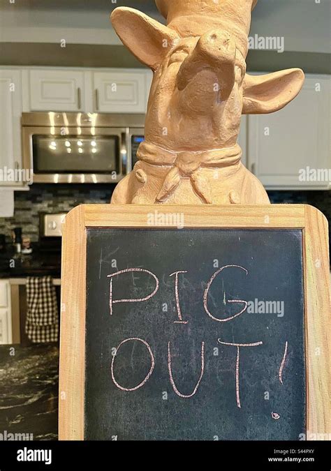 Kitchen With Pig Holding Chalkboard Says PIG OUT Stock Photo Alamy