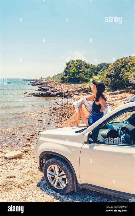 Woman Laying At Car Hood With View Of Sea Summer Beach Stock Photo Alamy