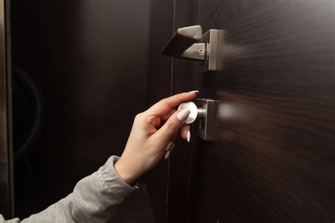 Premium Photo Woman Hand Unlocking Door With Key