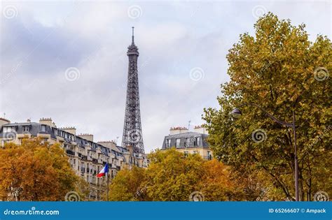 Autumn In Paris Town Homes Among Yellow Trees Background Eiffel Tower