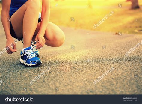 Young Woman Runner Tying Shoelaces Stock Photo 227155408 Shutterstock