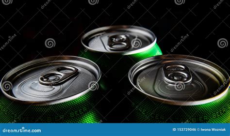 Three green cans of beer stock photo. Image of drink - 153729046