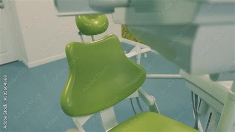 New dental chair in the dental office. Dental clinic interior design with chair and tools ...