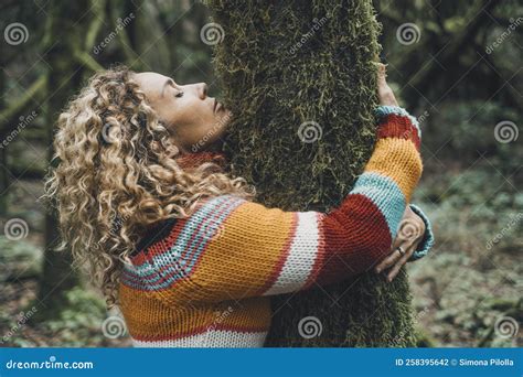 Side View Of Woman Hugging A Tree With Green Musk In Love Concept Of