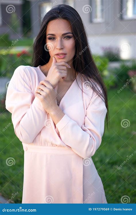 Brunette Wearing Beige Dress Posing On The Pavement Stock Image Image Of Adult Beauty 197279569