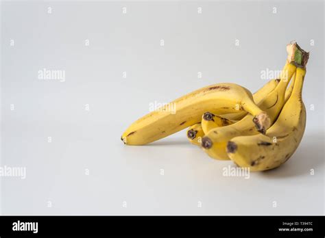 Yellow Bananas On White Background Right Orientation With Copy Space