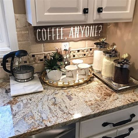 A Kitchen Counter With Coffee Mugs And Other Items On It That Says