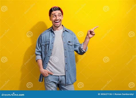 Photo Of Excited Funky Man Dressed Jeans Shirt Looking Pointing Finger Empty Space Isolated