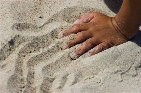 Hand in sand | Stock image | Colourbox