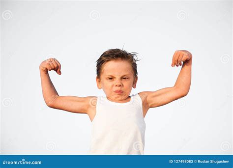 Funny Little Caucasian Kid with Grimace on His Face Showing Biceps ...