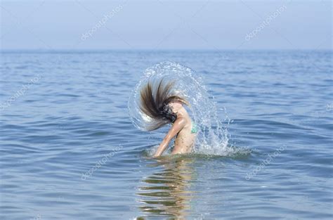 Beauty Model Girl Splashing Water With Her Hair Teen Girl Swimming And