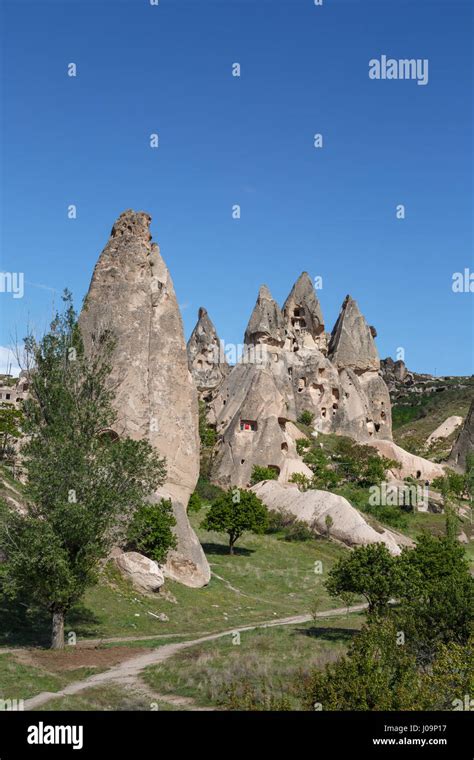 Landscape view of famous sandstone tufa caves and fairy chimneys around cappadocia area on ...