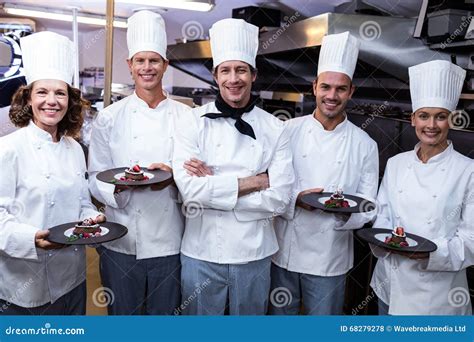 Happy Chefs Presenting Their Dessert Plates Stock Photo Image Of Dish