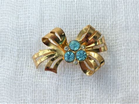 Coro Gold Washed Bow Brooch With Three Aqua Blue Diam Gem