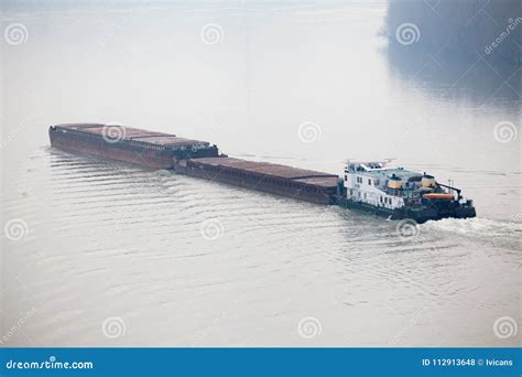 Tugboat Pushing A Heavy Barge Stock Photo Image Of Transport Vessel