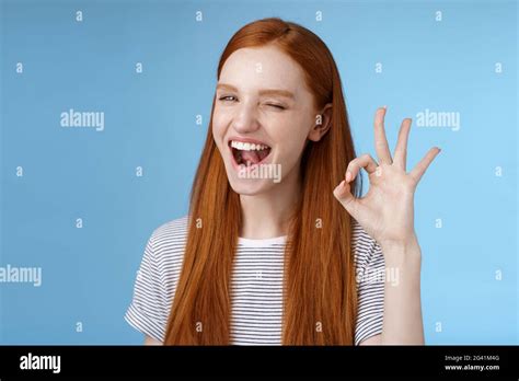 Sassy Attractive Redhead Girl Winking Mysteriously Smiling Broadly Give Approval Sign Show Okay