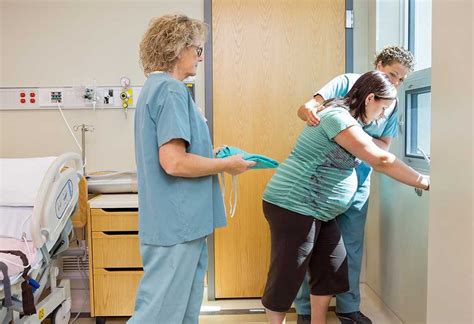 A Pregnant Woman In Labour Walking Around