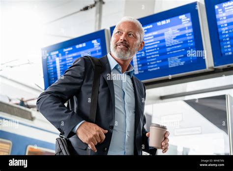 Mature Businessman At The Train Station Stock Photo Alamy