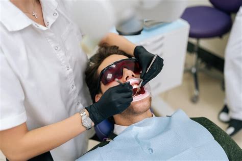 Premium Photo Closeup Of Unrecognizable Female Dentist Using Modern