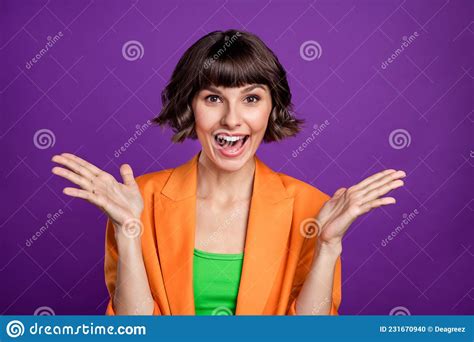 Photo Of Impressed Millennial Brunette Lady Hands Up Wear Orange Blazer