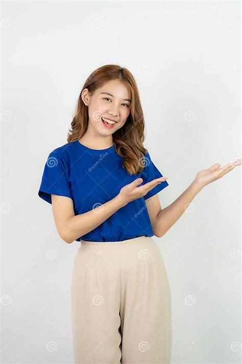 Cheerful Friendly Assertive Young Asian Girl Wearing A Light Blue T Shirt Relaxed Carefree