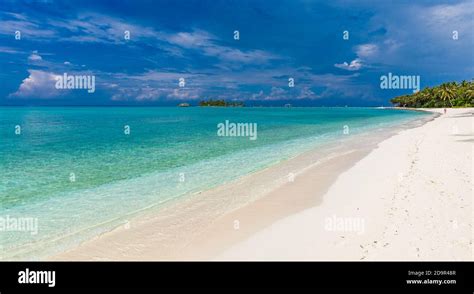 White sandy beach in Maldives with amazing blue lagoon and blue sky ...