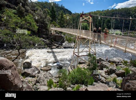 People Cross The Alexandra Suspension Bridge Over The Cataract Gorge At